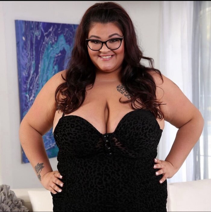 Raven Belle in a black dress